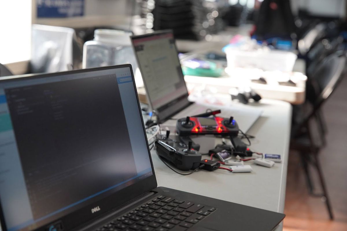 Drone equipment with FPV goggles and controller on workbench